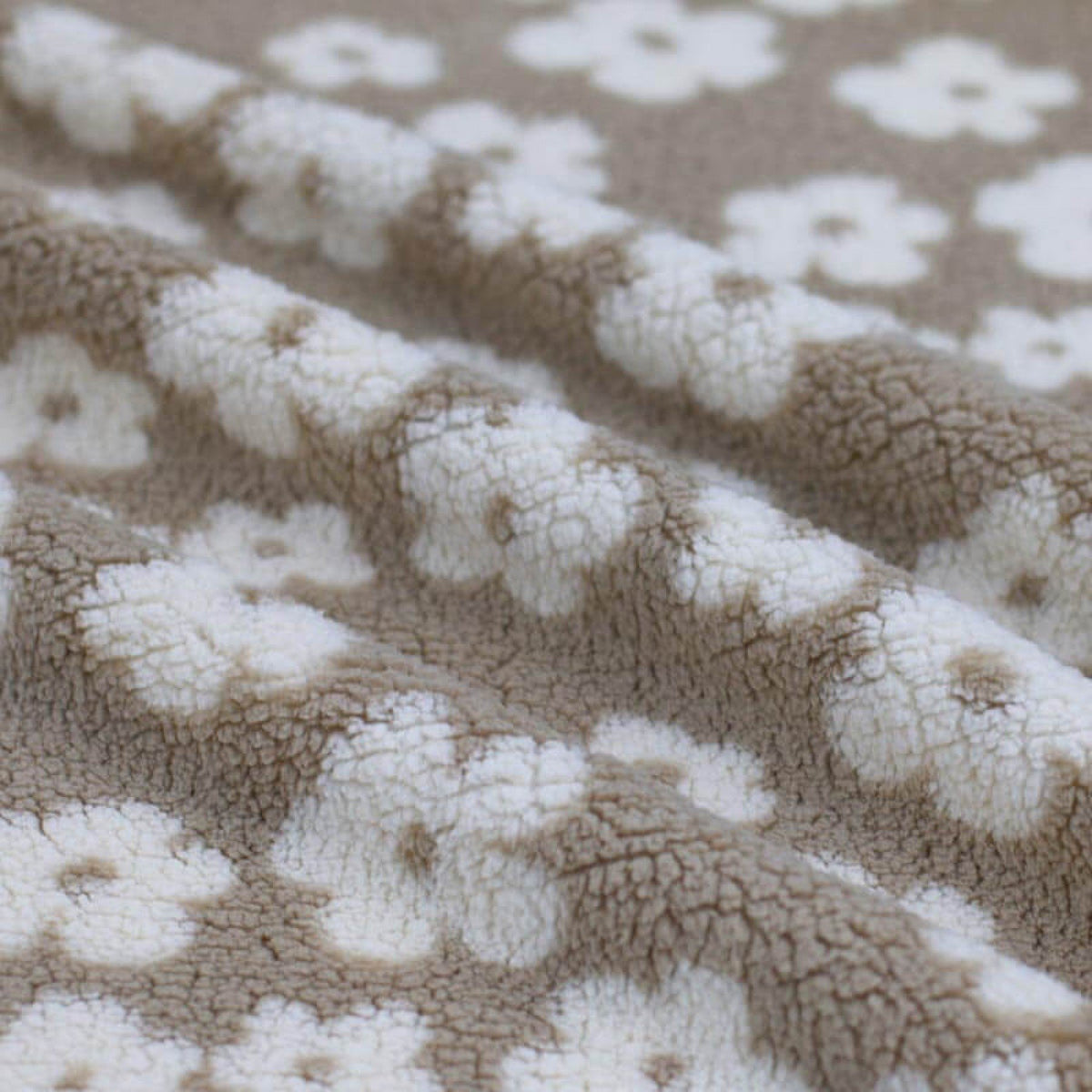 0.5m Teddystoff Blume beige